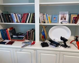 books, platter, vase, model planes, camera tripod...
