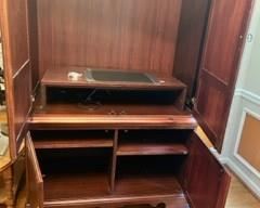 Inside of entertainment cabinet.