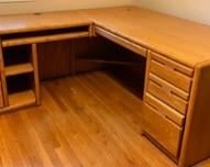 L-Shaped desk with pullout keyboard panel. 32"D x 29-1/2"H x 68"L