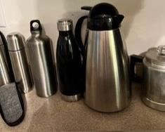 Thermoses (thermi? Is that a word?), coffee carafe, and vintage aluminum stovetop percolator