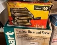 Vintage french fry cutter, pasta maker, and contemporary coffee pot