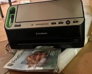 FoodSaver system - NEW. Tons of bags of all kinds for vacuum sealing. Selling as a set. 