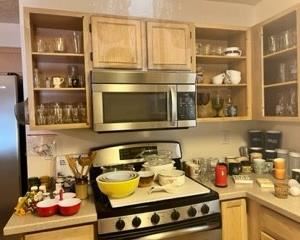 On the left on the counter behind the red triple server bowl, lots of vintage salt and pepper shakers! Trust me. You have to come to see them. 