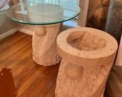 set of stone Tasselated end tables with glass tops (but listen, if you don't like glass, these are great for displaying plants, large statuary, your Academy Award and Emmy, and other large items) 
