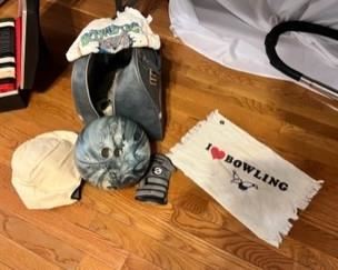 Bowling ball with bag, glove, towels, and even shoes