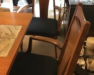 Chairs are by MCM 4 side chairs and two are chairs total 6 chairs table is quite unusual teak with interesting inlaid ceramic tiles.