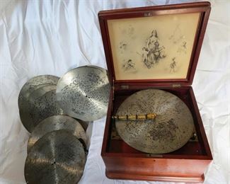 Antique Regina Music Box... 14 1/2" x 13 3/4" x 9"... Plays 11" discs. $1,200.00