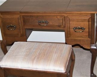 Bedroom vanity with mirror inset in the center