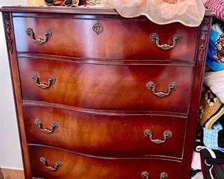 Mirrored dresser, part of a queen bedroom set. Antique dolls and misc. decorations