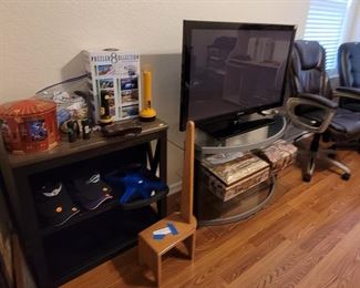 TV, TV stand, bookshelf, desk chairs