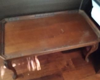 Antique coffee table with ornate edging