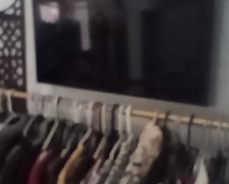 Smart TV
And gold clothes racks 
Lots of clothes... size 8 to 12. Suits maxi dresses, capris and jeans galore