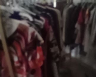 3 gold clothes racks and lots of clothes, side of antique piece shown earlier 