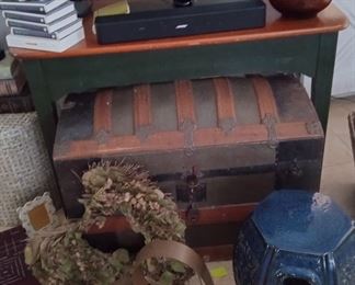 TV, old antique trunk, blue stool 