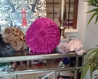 Beautiful mirror chest, nice tall lamp and wool pillows and fur hats