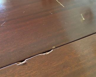 H303 - Solid Wood Drop Leaf Table, Measures 48" x 28" with leaves down. 30" tall. Each leaf adds 24". Does have a chunk out of one leaf that measures about 1" see photo. 