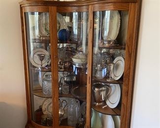 H9 - $300. Curved Glass China Cabinet. Measures 44" wide across the front and 72" tall. Comes out from the corners 29.5" each side. 