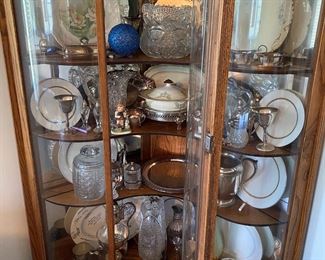 H9 - $300. Curved Glass China Cabinet. Measures 44" wide across the front and 72" tall. Comes out from the corners 29.5" each side. 