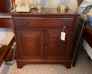 H122 - $40. Single Wooden Nightstand. Measures 27" wide x 17" deep x 27" tall. 