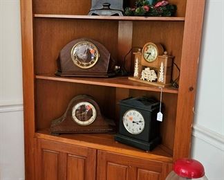 Corner cabinet, shelf clocks, and bubble gum machine (items sold separately)
