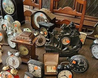 Small Clocks of all types, including a sailing ship cast iron clock (clocks sold separately)