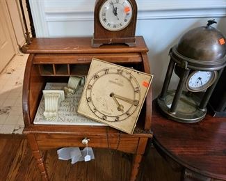 Child's roll top desk, several clocks, including a metal dome clock (items sold separately)