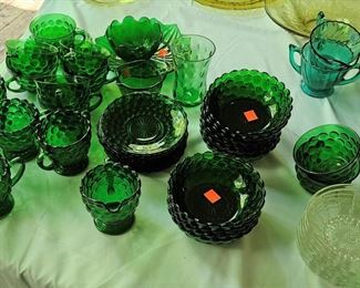 Dark green depression glass, sold as sets and individual pieces