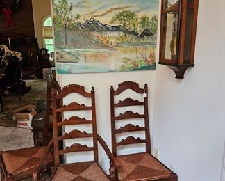 Art, rush seat chairs, and wall clock (items sold separately)