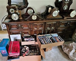 Mantel clocks, modern dresser with twon mirrors, DVDS and other items (items sold separately)