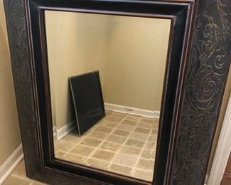 Very large metal framed mirror
