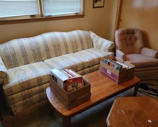 Floral print couch, Rose colored chair, Oak cocktail and end table, miscellaneous books & more