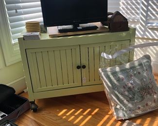 TV in working condition and a cabinet. 