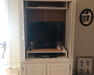 TV armoire  and working TV. 