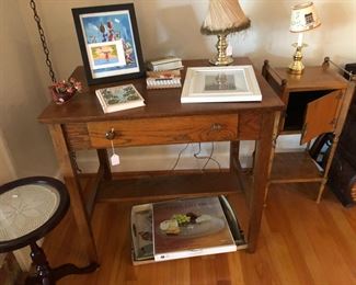 Antique desk with an ink well and quill slot. 