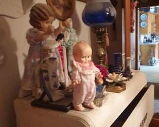dolls and blue glass lamp