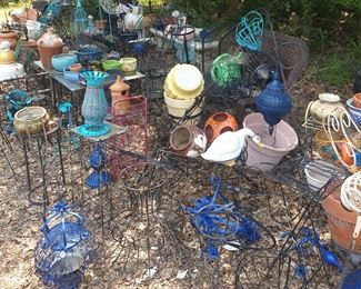 metal yard art and  pots for plants