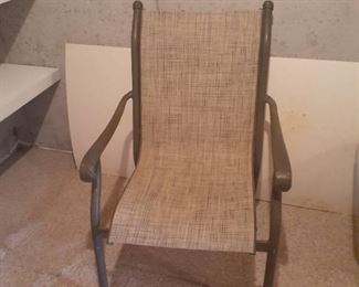 Outdoor patio chair. Located in basement but basement has a walkout area