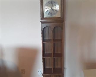 Butler grandfather clock with shelves and storage area. 67 x 16 x 9. Located in basement  (has walkout)