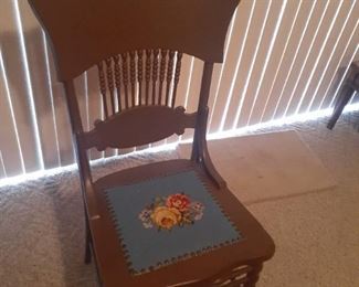 Wooden chair with embroidered seat