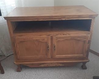 Wooden television stand with bottom storage. 31 x 40 x 21. Located in basement (has walkout)