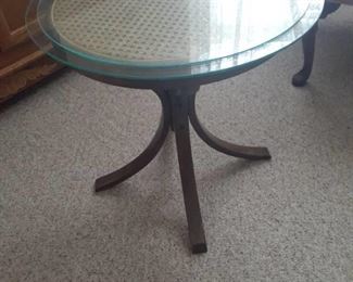 Round side table with wicker top and (2) glass tops. 20 x 21 diameter. Located in basement (has walkout)
