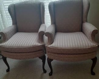 (2) Mauve colored high back chairs. Located in basement (has walkout)
