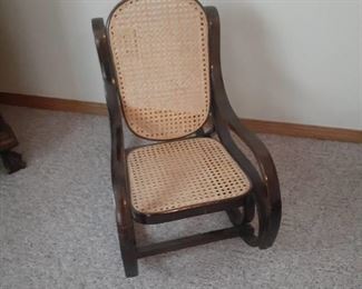 Childs bent wood rocker with wicker back and bottom