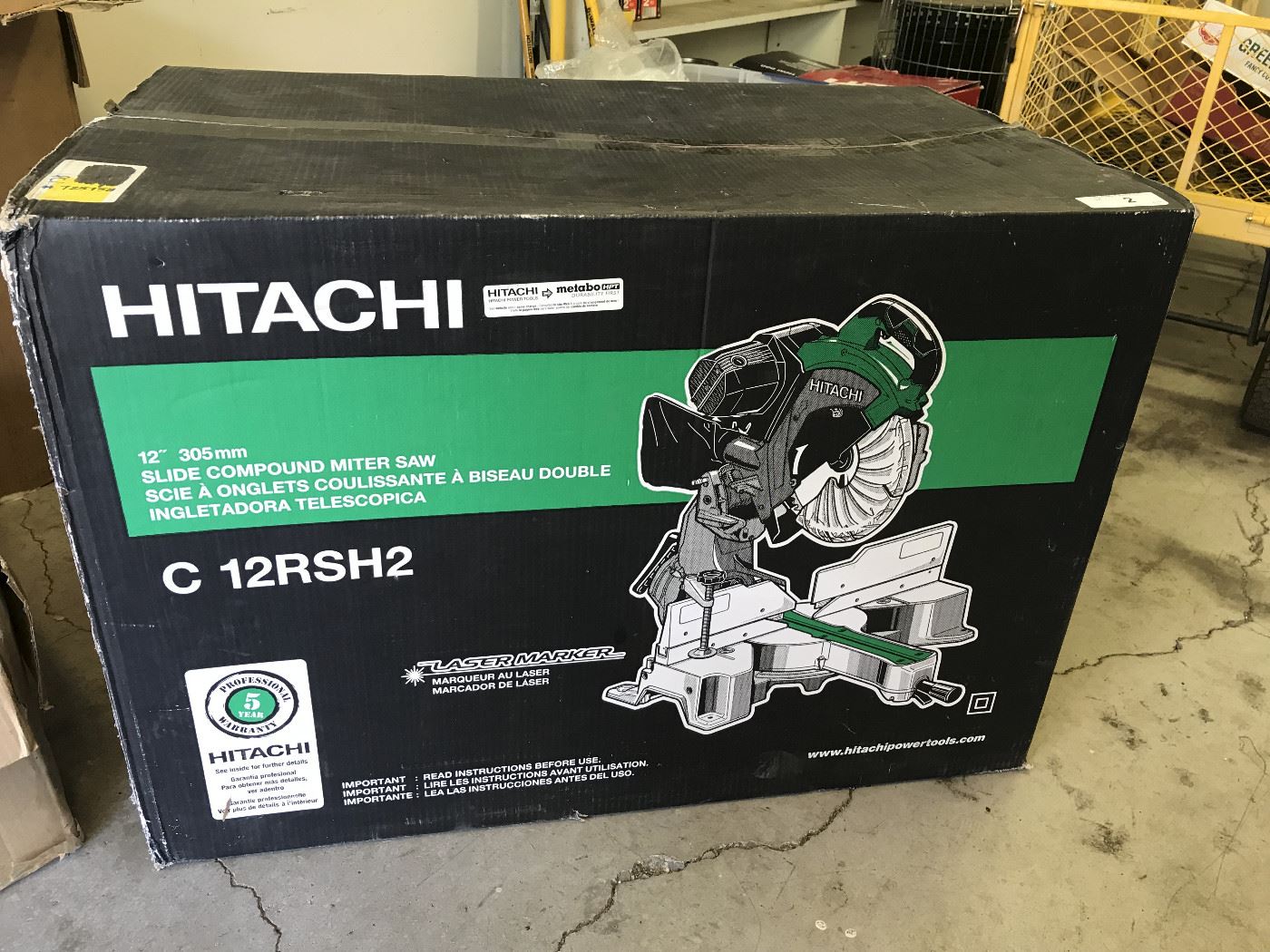 Lot # : 2 - Tool - Hitachi 12" 305mm Slide Miter Saw
model# C12RSH2, laser marker, adjustable sliding fence, safety guard, dust bag and original box.
