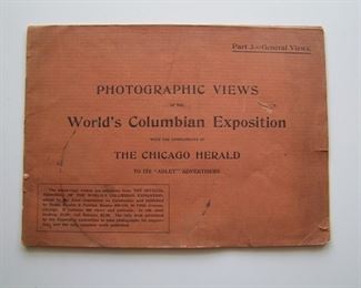 Lot 012    1893 Photographic Views of the World Columbian Exposition, 20 pages.  All photo images "Compliments of the Chicago Herald", 8" x 11".  Cond:  Minor wear with light circular stain on cover.  Est. $30-50.