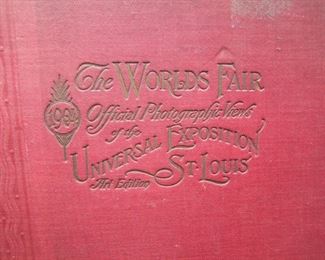 Lot 020    1904 Saint Louis World's Fair Official Photographic Views, Library Edition, 306 pages.  Fully illustrated with official views of the buildings, cultural exhibits and art works of Importance, includes a large section of Native American images shown by tribe. 11" x 13 1/2".  Cond:  Cover attached but loose, moderate wear overall, small tear at top of spine.  Est. $70-100.