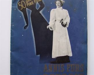 Lot 125   1937/38 Annis Furs, Detroit Fine Furs Catalog, 38 pages.  2-color cover, B&W photograph interior, 50th Anniversary catalog, 10" x 13 1/2" h.  Includes a brass lighter stamped "Compliments Annis Furs, Detroit", 2 1/2" long.  Cond:  Catalog has minor wear.  The brass lighter has turned very dark and has wear from use.     Est. $50-70.
