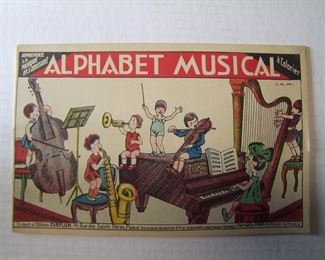 Lot 173   C/1930 French Childs Coloring Book "Alphabet Musical". 7 1/2" X 11 1/2", 8 color/B&W pages, printed in Paris.    Cond: Unused, slight toning from age.     Est. $30-50