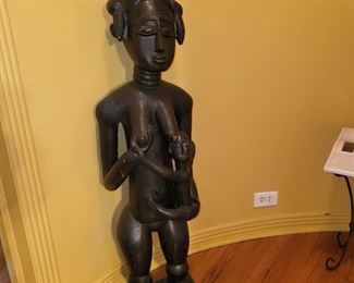 sculpture of a free-standing mother and child figure with smooth finish the artist is likely Baule