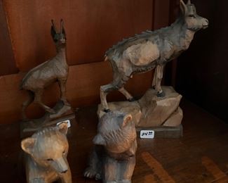 Assortment of carved animals bears moose